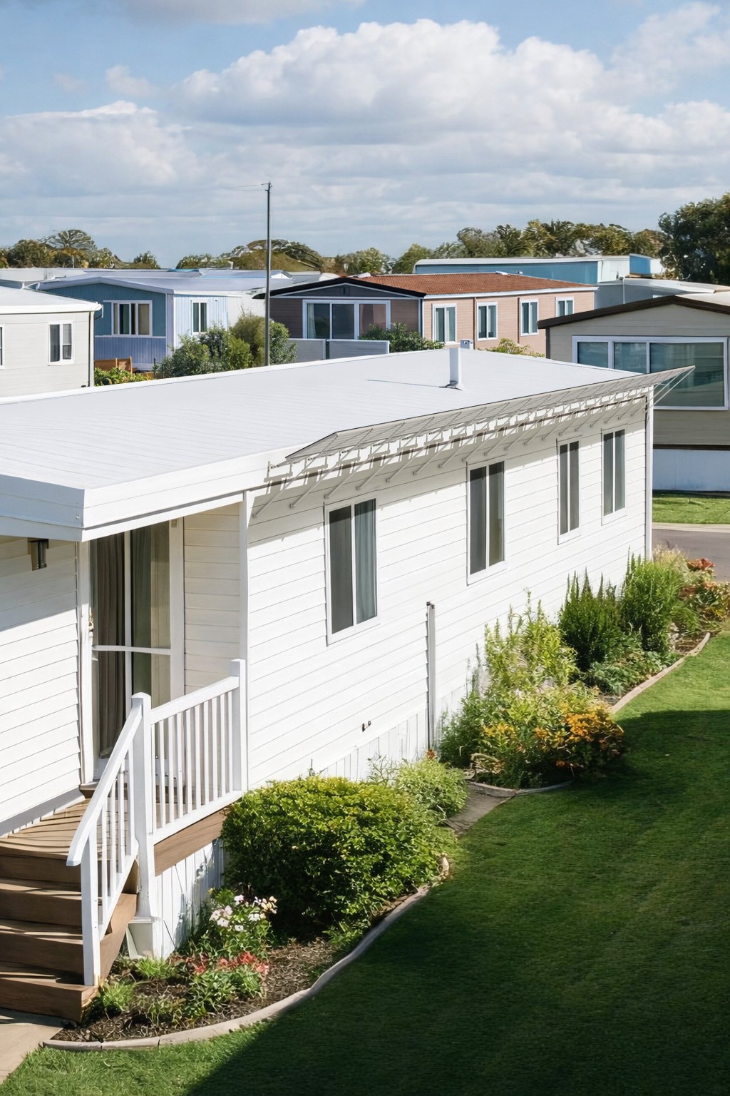 A manufactured home with panels attached near the roof line.