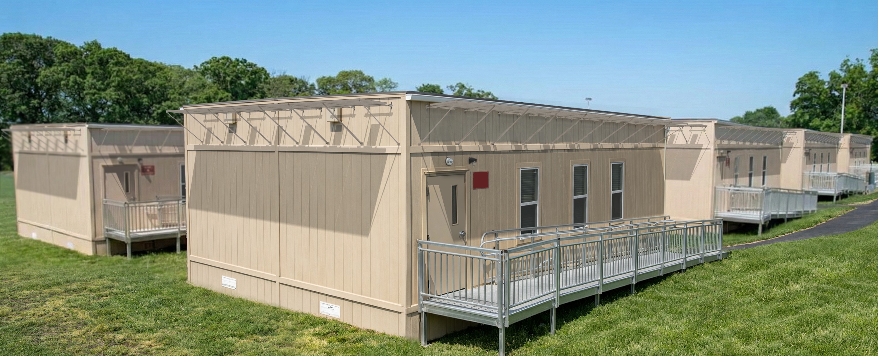 A modular building with solar panels near the roof line.