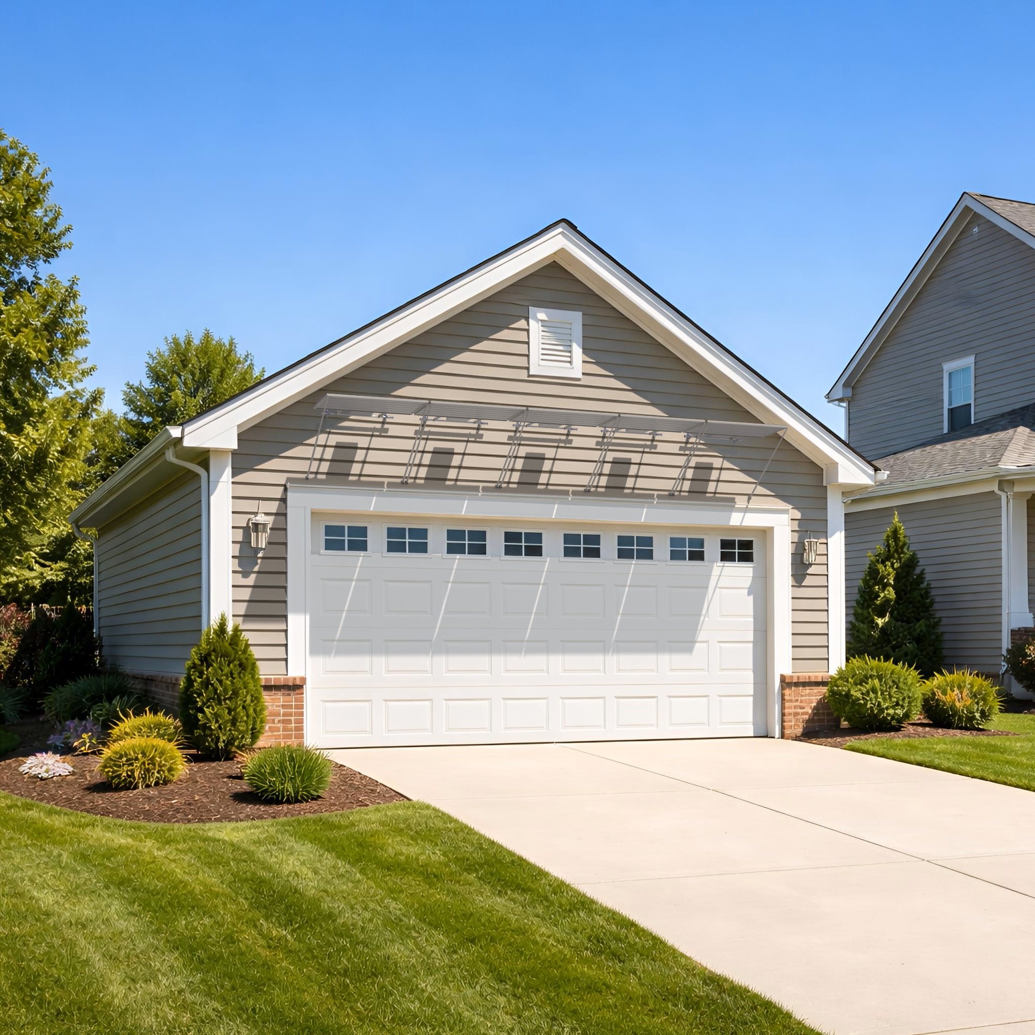 A garage with PowerGrab solar panels above the door.